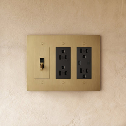 Custom brass light switch from Residence Supply, showing a sleek, vintage-style switch with brass finish and detailed craftsmanship.