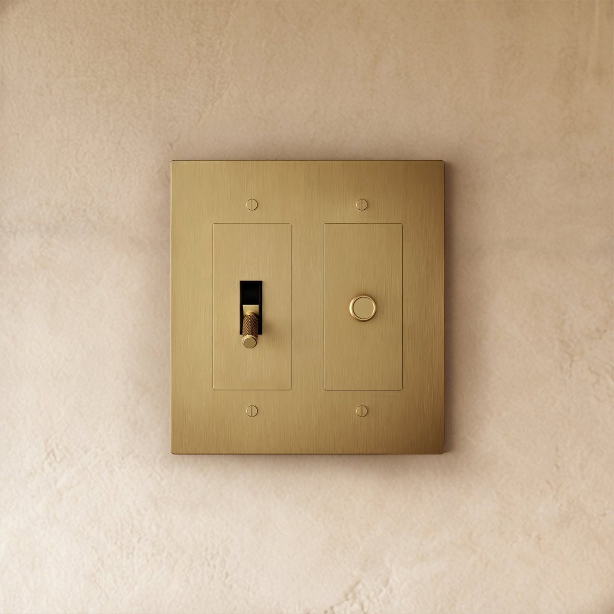 Custom brass light switch by Residence Supply with vintage design and toggle switch, showcasing detailed metal craftsmanship.