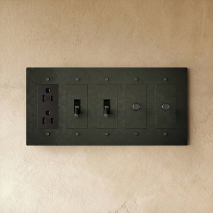 Custom brass light switch by Residence Supply with vintage-style toggle and brass finish for a customizable lighting control.
