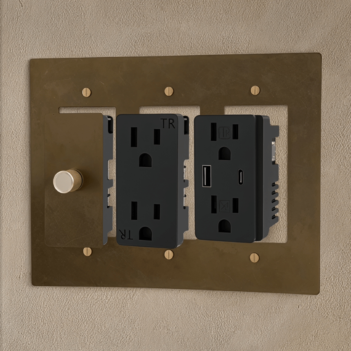 Custom brass light switch from Residence Supply, showing a sleek, polished brass switch with build-your-own design and testing setup.