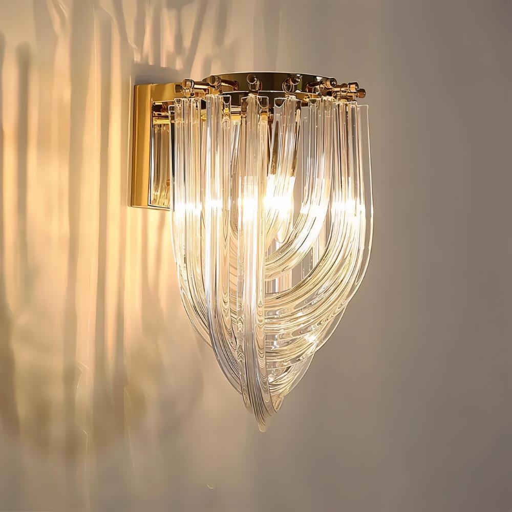 Danica Wall Lamp by Residence Supply mounted on a wall, featuring a sleek modern design with a white shade and metallic accents.