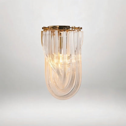 Danica wall lamp by Residence Supply featuring a sleek modern design with a metal finish and adjustable arm for ambient lighting.