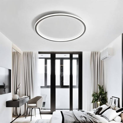 Modern Dayira ceiling light by Residence Supply featuring a sleek, circular design with frosted glass shade and metal finish.