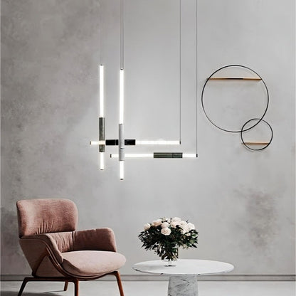 Modern Delia Pendant Light from Residence Supply hanging in a stylish living room with a sleek design and warm lighting.