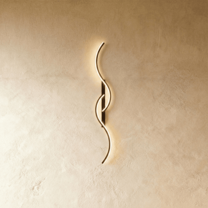 Modern Denisse Wall Lamp by Residence Supply with sleek metal finish and minimalist design, mounted on a wall.