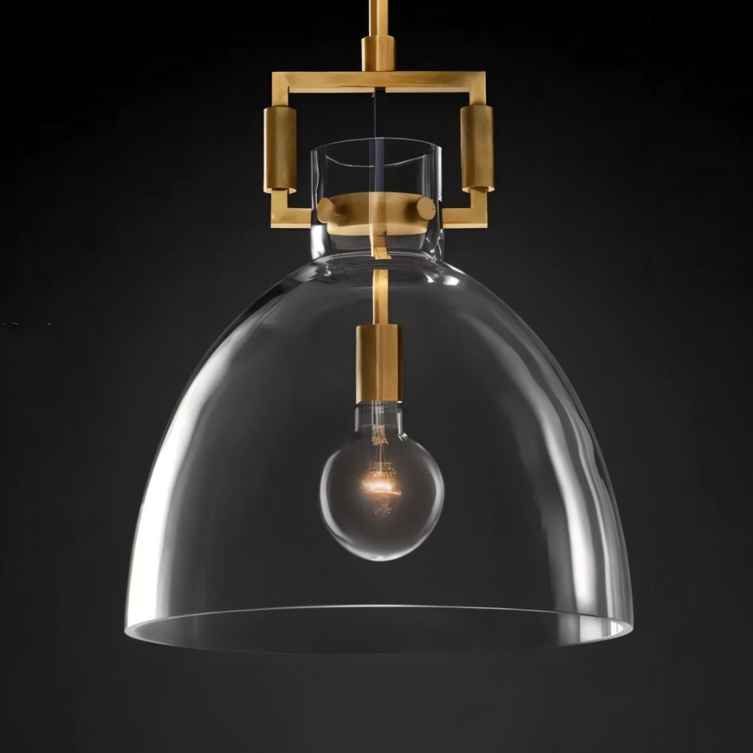 Modern Dennise Pendant Light by Residence Supply with a sleek metal finish and clear glass shade hanging from a ceiling mount.
