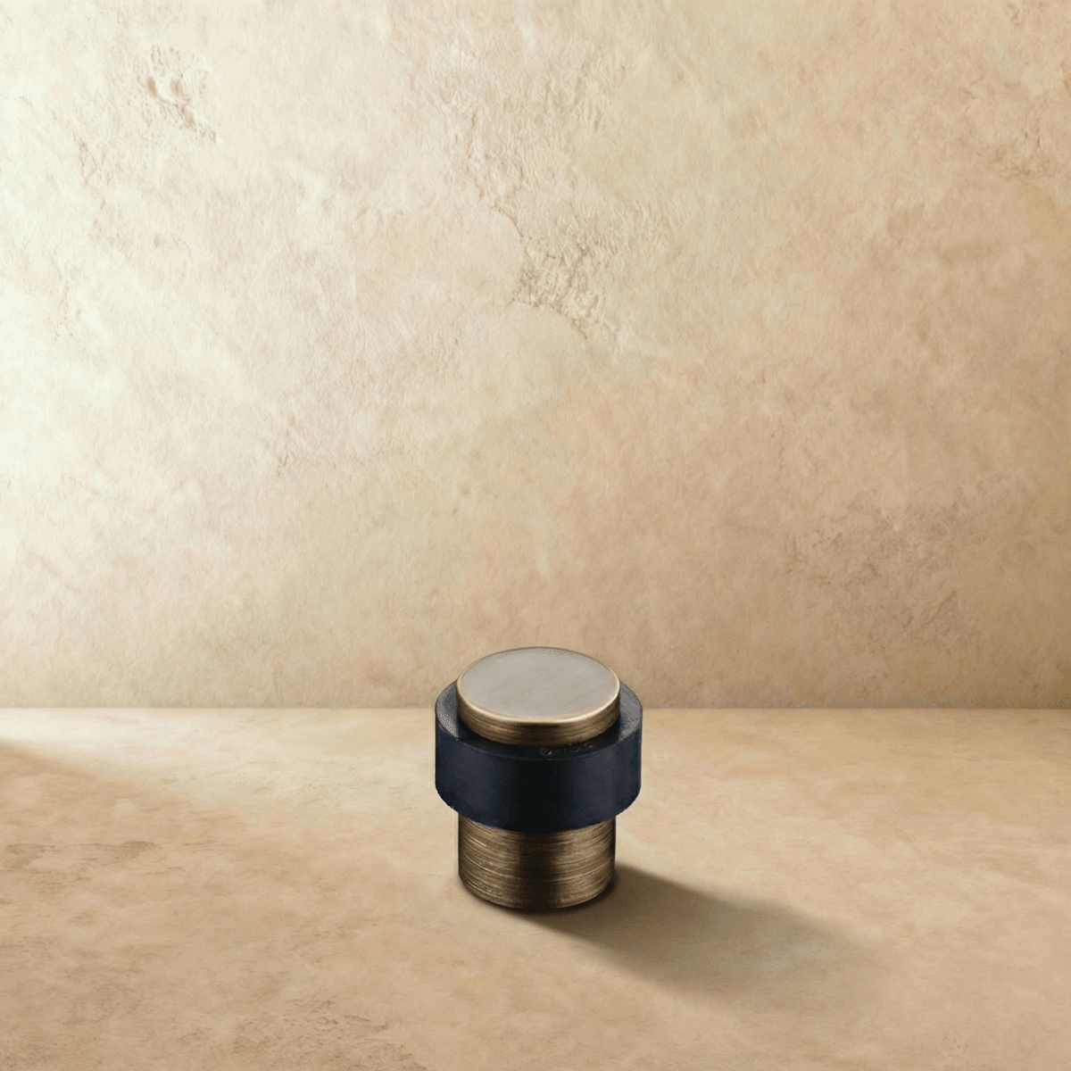 Residence Supply Desist Door Stop mounted on a wall, durable door hardware for preventing door movement in home and garden spaces.