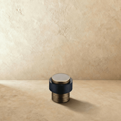 Residence Supply Desist Door Stop mounted on a wall, durable door hardware for preventing door movement in home and garden spaces.