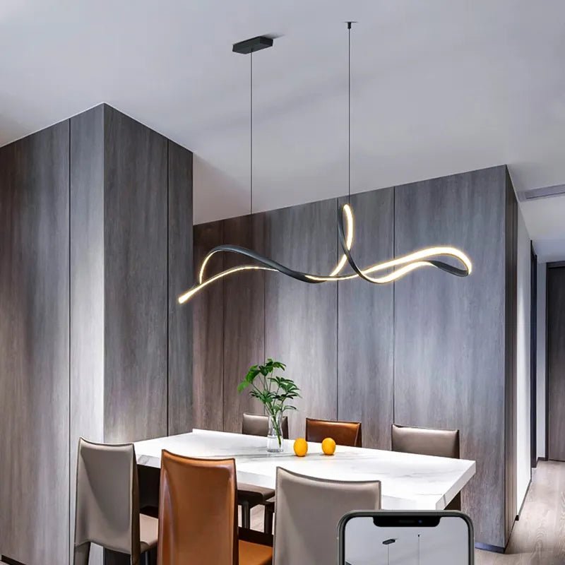 Diana Pendant Light by Residence Supply hanging from ceiling with a modern design and clear glass shade.