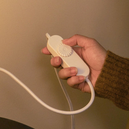Terra Labs radiator-style table lamp with adjustable dimmer control, modern design, and warm ambient lighting.