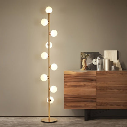 Modern Domena Floor Lamp by Residence Supply with a sleek metal stand and fabric shade, ideal for living room or office lighting.