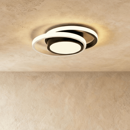 Doveva ceiling light fixture with modern design and metal finish, mounted on a ceiling for ambient room lighting.
