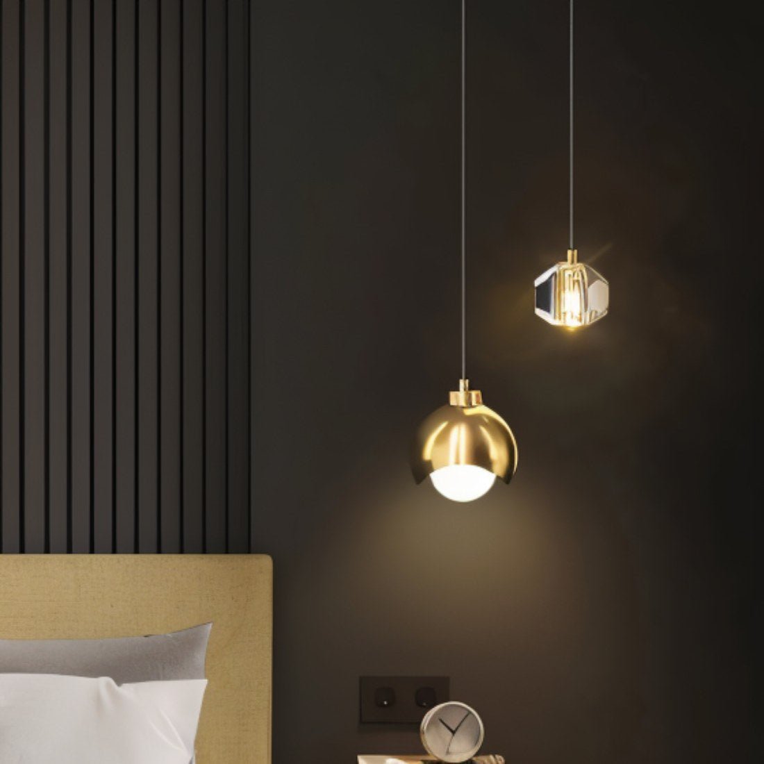 Two sleek pendant lights from Residence Supply with black metal fixtures hanging from a ceiling.