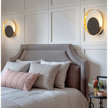 Modern Eclipse Wall Lamp by Residence Supply featuring a sleek black design and a circular, moon-inspired shape for stylish lighting.