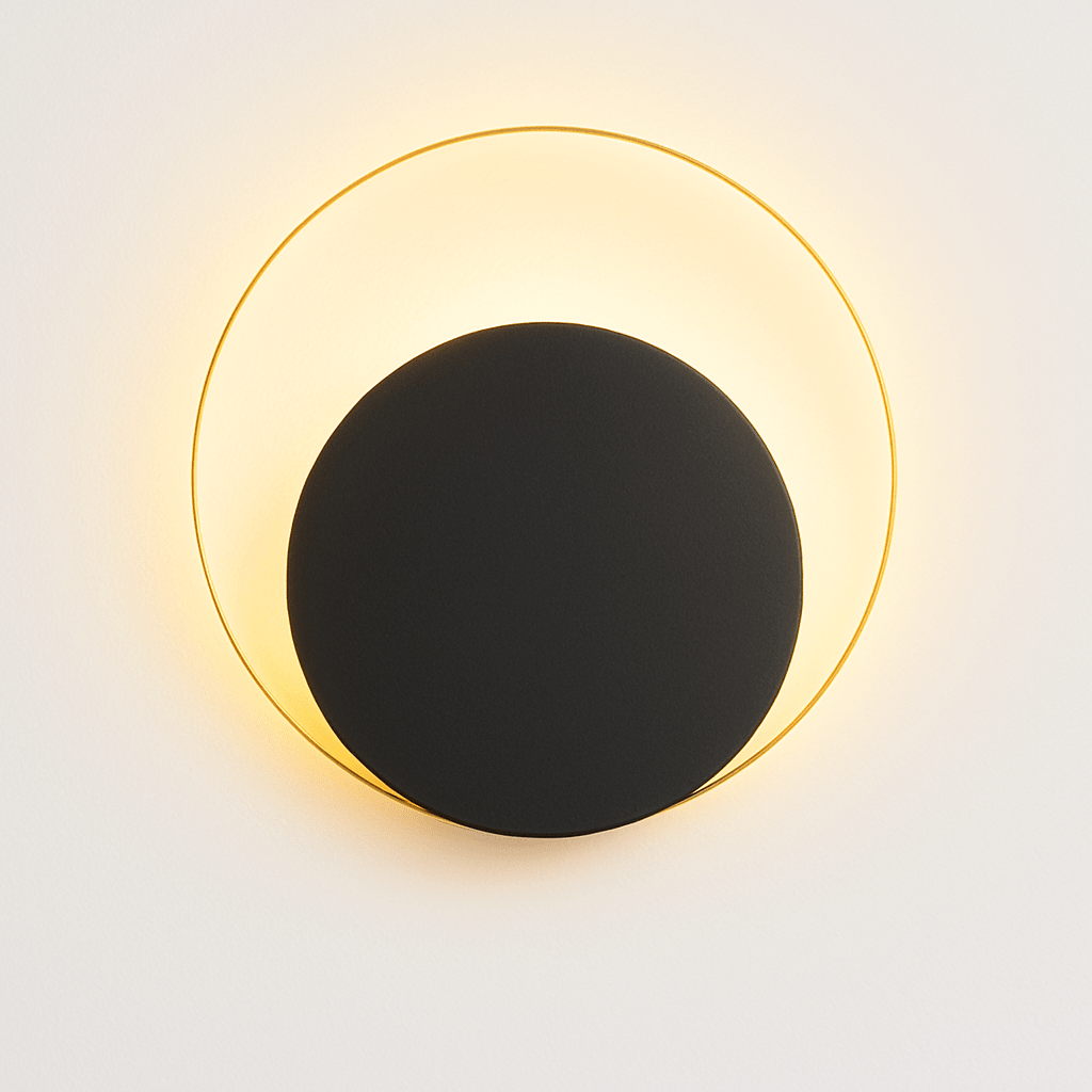 Residence Supply Eclipse Wall Lamp featuring a sleek, modern design with a circular black and gold finish on a wall-mounted fixture.