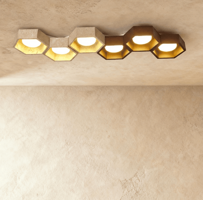 Electa ceiling lamp by Residence Supply featuring a modern design with a sleek metal finish and ambient lighting.