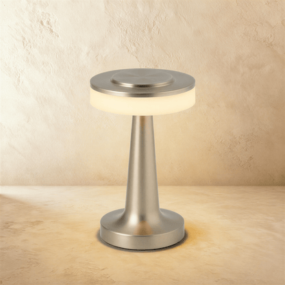 Ellen Rechargeable Table Lamp by Residence Supply with modern white shade and sleek base, illuminated on a wooden surface.