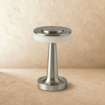 Rechargeable Ellen Table Lamp by Residence Supply with a sleek, modern design and a white lampshade on a wooden base.