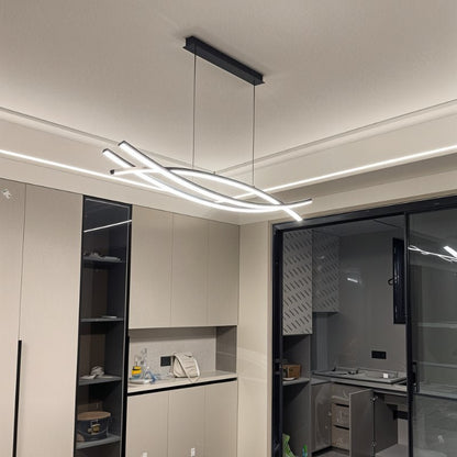 Eraj chandelier by Residence Supply featuring a modern design with multiple hanging glass orbs and metal accents for elegant lighting.