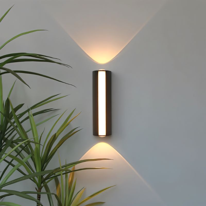 Outdoor wall lamp by Residence Supply featuring a sleek, modern design with a black finish and clear glass shade.