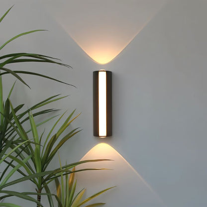 Outdoor wall lamp by Residence Supply featuring a sleek, modern design with a black finish and clear glass shade.