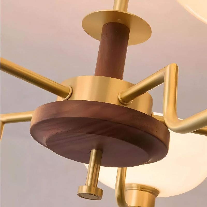 Eronix brass and wood chandelier with modern design, featuring multiple light fixtures and intricate detailing.