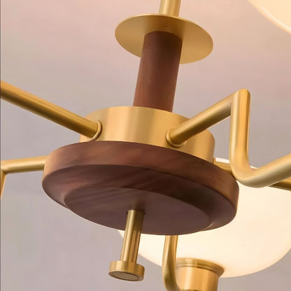 Eronix brass and wood chandelier with modern design, featuring multiple light fixtures and intricate detailing.