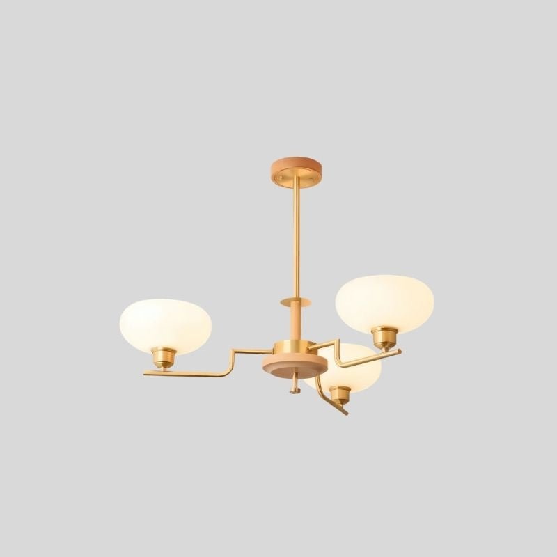 Eronix brass and wood chandelier with three glass lights hanging from a modern design fixture.