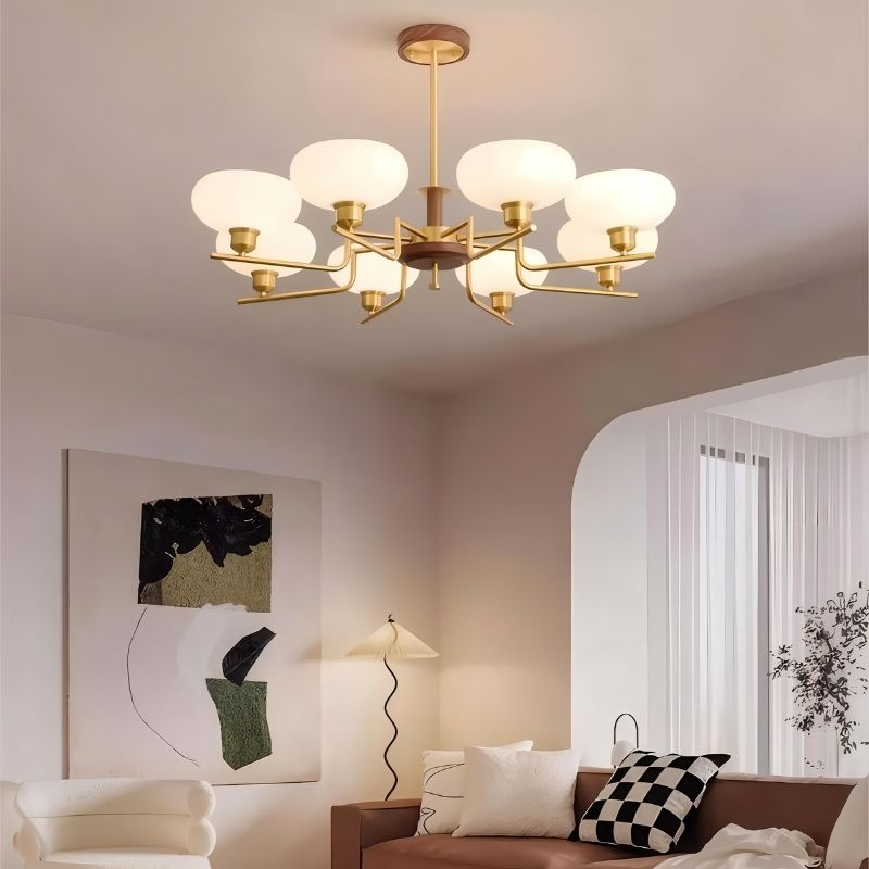 Eronix brass and wood chandelier with glass accents hanging in a living room, modern lighting fixture by Residence Supply