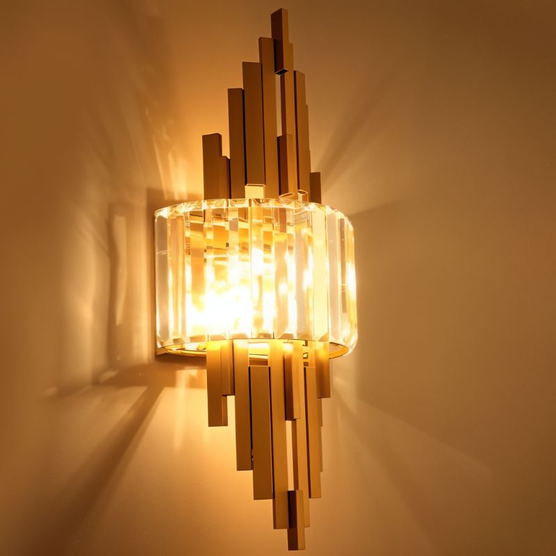 Eudora Wall Lamp by Residence Supply, modern design with sleek metal finish, mounted on a wall with warm lighting.