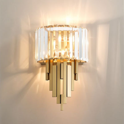 Eudora Wall Lamp by Residence Supply featuring a sleek design with a white shade and brass finish, mounted on a wall.