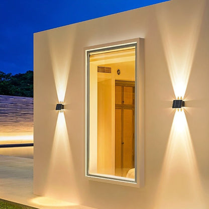 Exterior Residence Supply Exterius outdoor wall lamp with black finish and clear glass shade mounted on a wall.