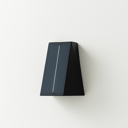 Exterior Exterius outdoor wall lamp by Residence Supply, mounted on a wall with a modern black metal design and clear glass shade.