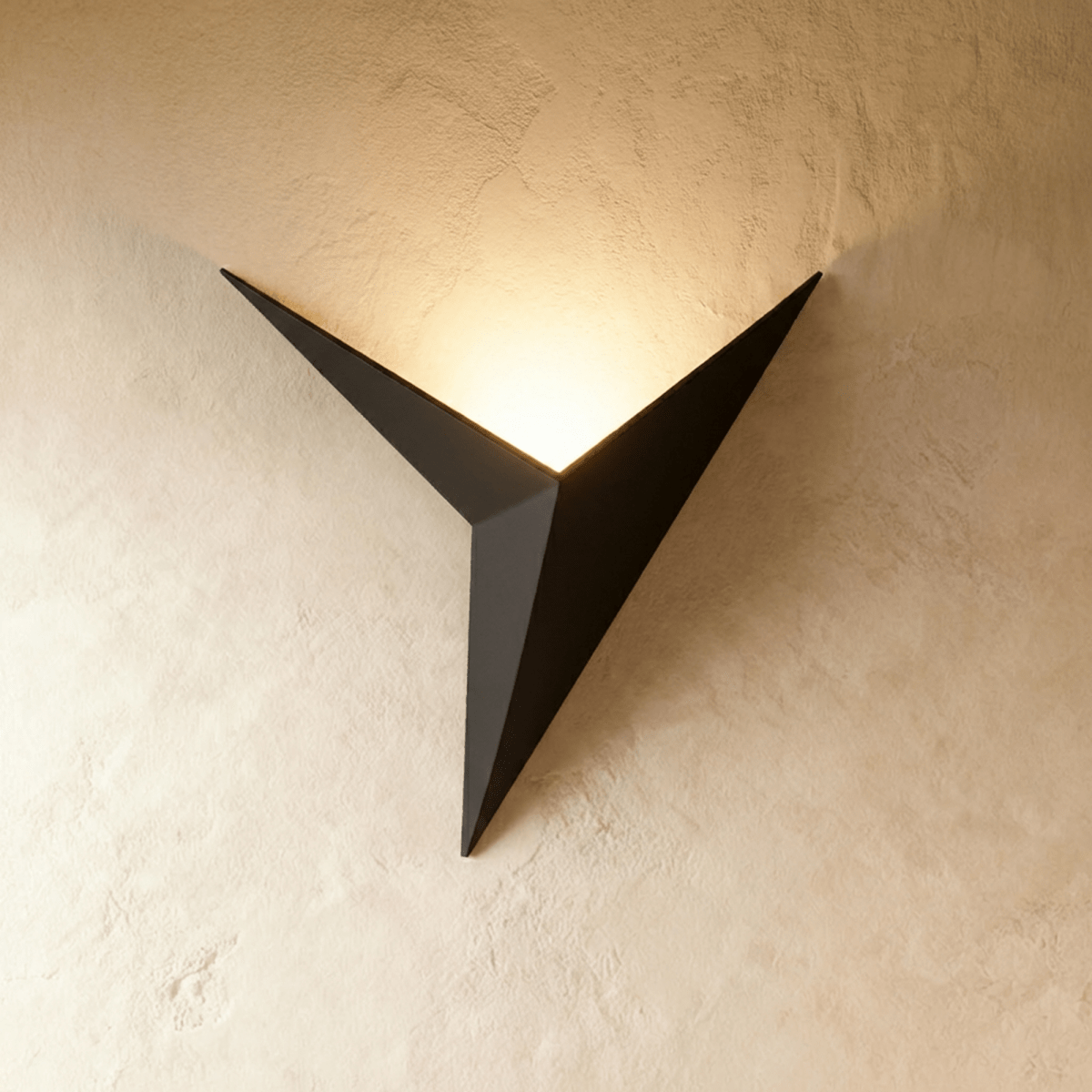 Ezio wall lamp by Residence Supply featuring a sleek modern design with a curved arm and stylish metallic finish.