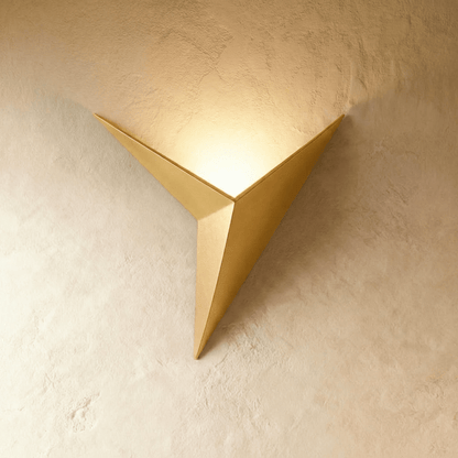 Ezio Wall Lamp by Residence Supply featuring a sleek design with a metal arm and modern white shade mounted on the wall.