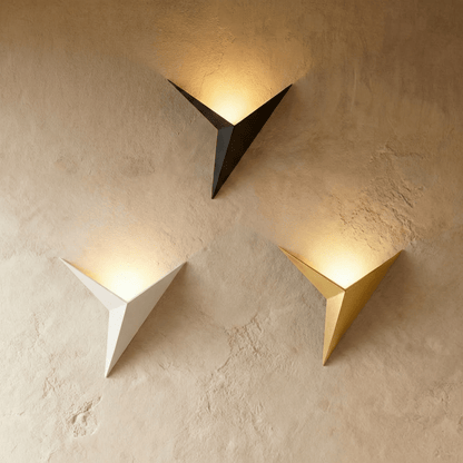 Ezio wall lamp by Residence Supply featuring a sleek modern design with a curved metal arm and a cylindrical shade.