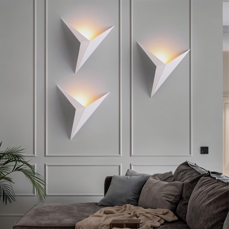 Ezio wall lamp by Residence Supply featuring a sleek modern design with a round shade mounted on a wall bracket.