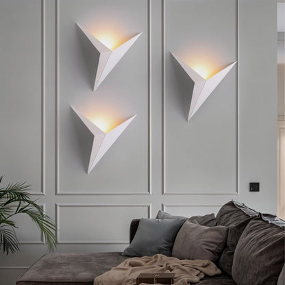 Ezio wall lamp by Residence Supply featuring a sleek modern design with a round shade mounted on a wall bracket.
