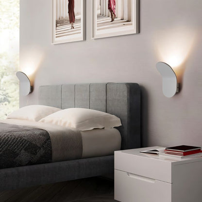 Fana Wall Lamp by Residence Supply featuring a modern design with a sleek metal finish and warm lighting for indoor decor.