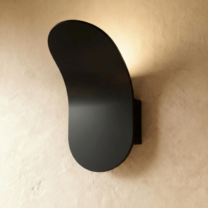 Fana Wall Lamp by Residence Supply featuring a sleek, modern design with a curved metal arm and white glass shade.