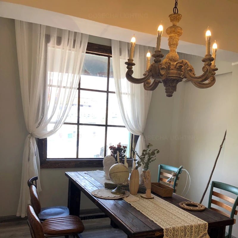 Elegant Fanaan chandelier by Residence Supply with intricate metalwork and multiple hanging glass shades for sophisticated lighting.