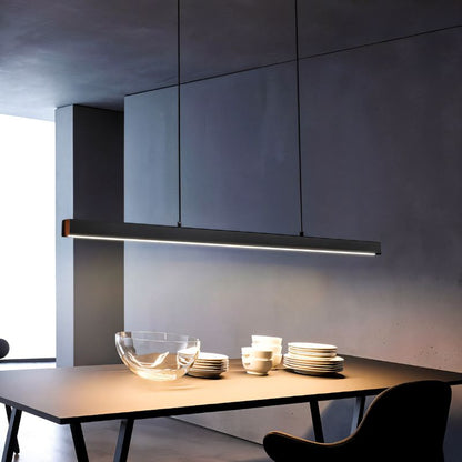 Faven Pendant Light by Residence Supply hanging from ceiling with a sleek modern design and warm lighting.