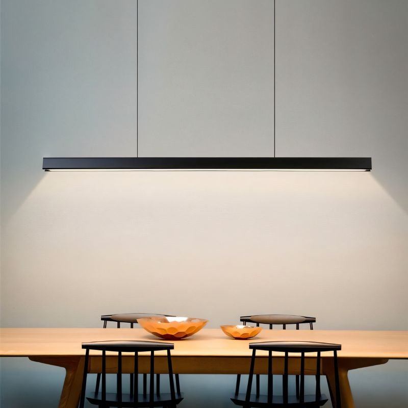 Faven Pendant Light by Residence Supply hanging with a modern design featuring a sleek metal finish and warm illumination.