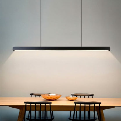 Faven Pendant Light by Residence Supply hanging with a modern design featuring a sleek metal finish and warm illumination.