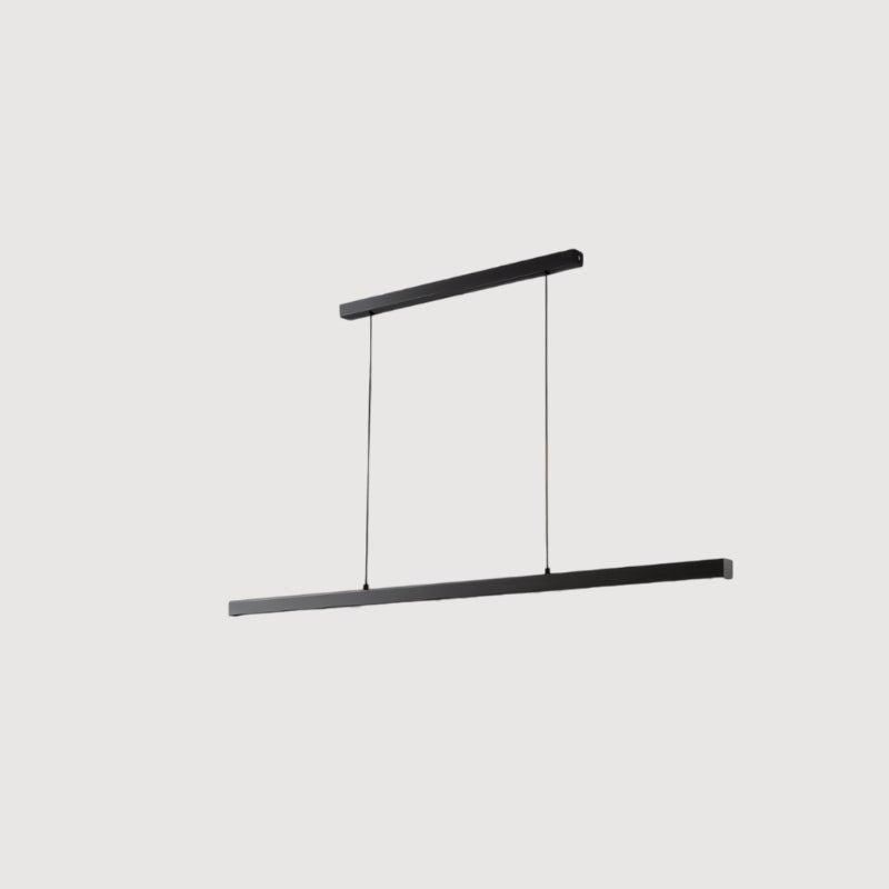 Faven Pendant Light by Residence Supply hanging from ceiling with a modern design and warm lighting in a stylish living space.