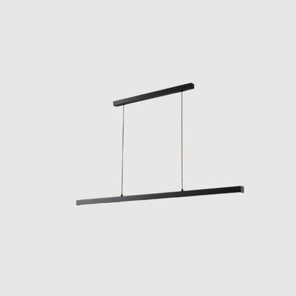 Faven Pendant Light by Residence Supply hanging from ceiling with a modern design and warm lighting in a stylish living space.