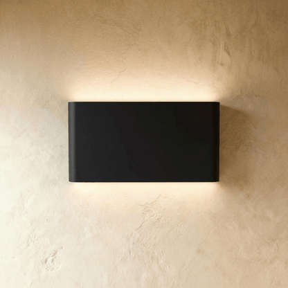 Femi Wall Lamp by Residence Supply, modern wall-mounted lighting fixture with sleek metal design and adjustable arm.