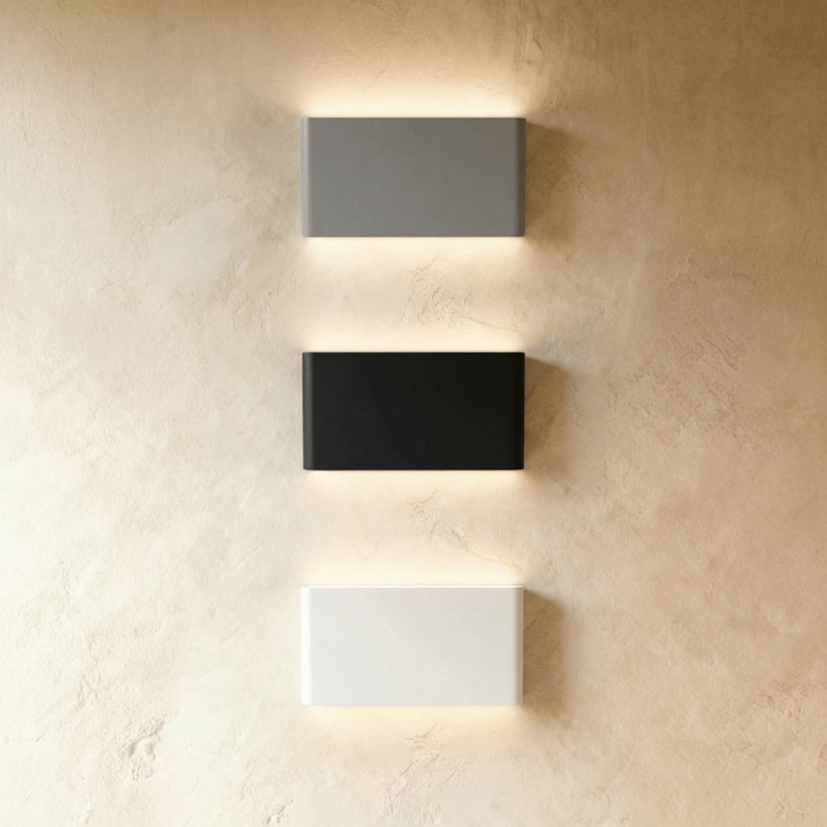 Modern Femi Wall Lamp by Residence Supply featuring a sleek metal design and warm lighting for contemporary interior decor.