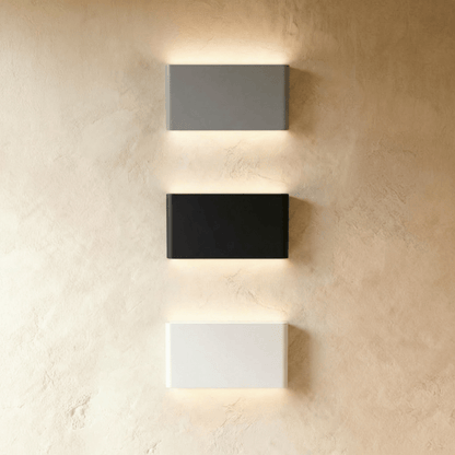 Modern Femi Wall Lamp by Residence Supply featuring a sleek metal design and warm lighting for contemporary interior decor.