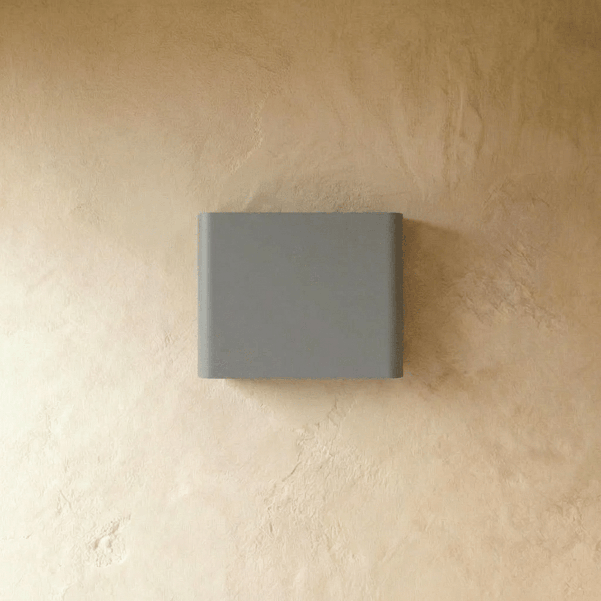 Femi wall lamp by Residence Supply with a sleek, modern metal design and adjustable arm for ambient lighting in living spaces.